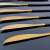 Cuchillo dorado y negro - comprar online