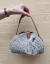 Bolso pequeño tejido en crochet con cuero
