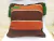Cojín decorativo tejido colores tierra - Lanas de Tenjo