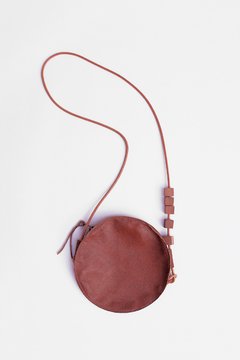 Bolsa redonda em couro
