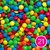 21- Lentejas de chocolate tipo rocklets x 100 grs