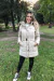 Campera de mujer larga con cinturón y piel en interior.