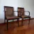 (JB) Seis sillas, dos con apoyabrazos, madera cerezo tapizadas en cuero, de Missura / 46 × 49 × 84/46 × 56 × 84