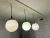 (MG) Tres lámparas vidrio opalina y varilla / 29 diámetro x 80 cm de altura (regulable)