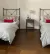 (MG) Dos camas de hierro gris con colchón y Blanqueria de Ramos Generales (edredón cubre edredón y almohadones ) Mesa de luz gris de hierro y madera