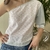 Blusa macrame asimmetrica