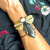 Bracelete Libélula Hematita e Madrepérolas no braço