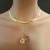 Conjunto colar relicário coração e gargantilha laminada 5mm - G219 - comprar online