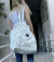 Tote reversible plateado y blanco en internet