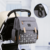 Imagen de Mochila maternal NEW LAND - Gris con flecha
