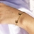 Pulseira com Pequenos Corações Chapados Folheado em Ouro 18k