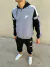 Conjunto Nike rompeviento combinado gris