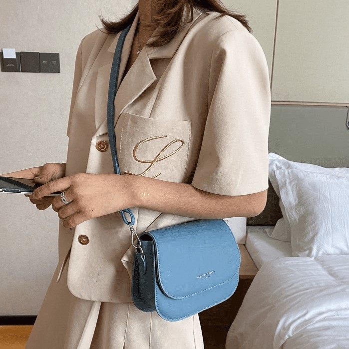 light blue cross body bolsa
