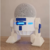 Imagen de Alexa Echo Dot (4ta Gen) - Bocina inteligente color blanco con reloj y Soporte para bocina Alexa Echo Dot 4 G tipo androide R2D2