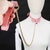 298 - Collar con cadena rosa en internet