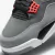 O Air Jordan 4 - Infrared é um tênis masculino de alta performance e estilo, disponível para compra e entrega pela sneakersjc. Seu design inclui camurça e tecido nas cores cinza, vermelho e preto, além de cadarços para ajuste ideal. Garanta agora o seu pa