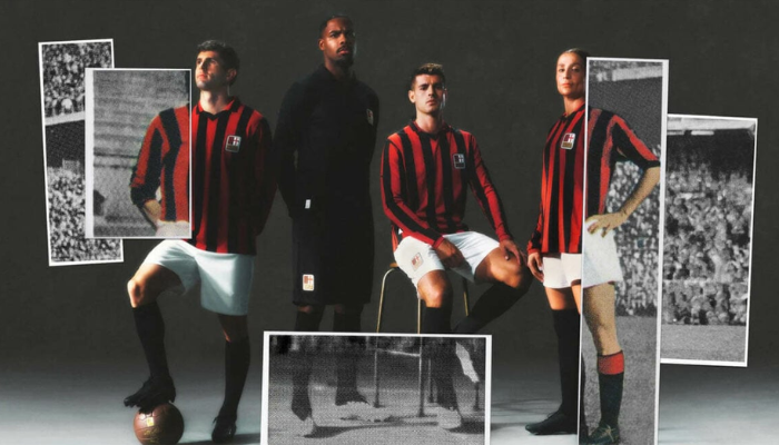 Camisa comemorativa de 125 anos do AC Milan: listras rubro-negras finas, gola polo e detalhes clássicos. Destaques incluem o escudo de 1899 e o icônico Diavoletto dos anos 80.