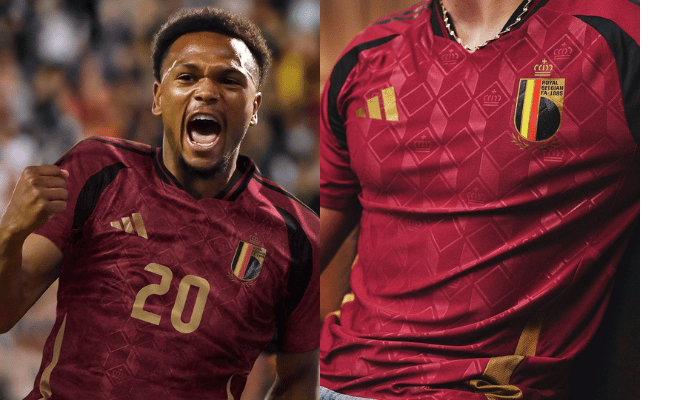 camisa titular da seleção belga 2024/25 da Adidas. A camisa é predominantemente grená com detalhes dourados e pretos. O corpo da camisa apresenta um mosaico em embossing com diversos losangos e coroas. Nas laterais, há dois arcos dourados. As três listras da Adidas nas mangas, a gola e os detalhes nas axilas são pretos.