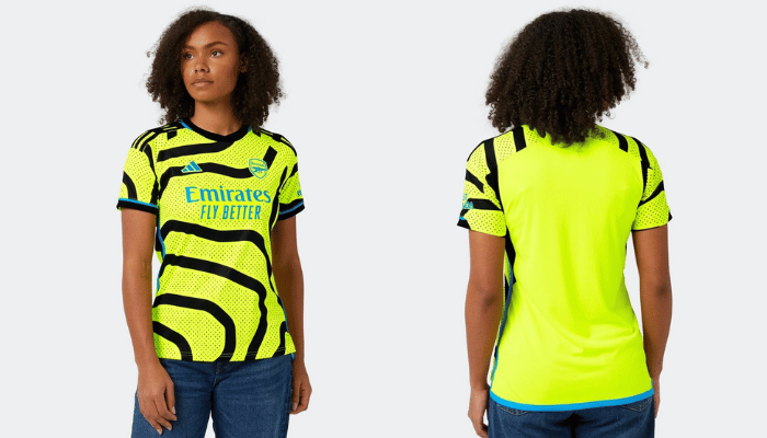 Camisa Reserva Feminina Arsenal 23/24 da Adidas em amarelo vibrante com gráficos pretos sinuosos, escudo do clube bordado no peito. Feita de poliéster reciclado, tecnologia AEROREADY para absorção de umidade, inserções laterais de malha. Estilo, conforto e conexão com a energia dos torcedores.