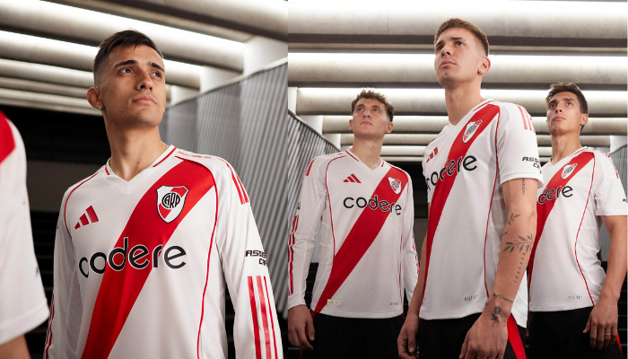 camisa titular do River Plate para a temporada 2024/2025, produzida pela Adidas. A peça é predominantemente branca, com a tradicional faixa diagonal vermelha e detalhes em vermelho nas mangas e gola. O escudo do River Plate e o logo da Adidas em sua nova versão estão presentes no peito. Na nuca, a palavra "Grandeza" em preto contrasta com o branco da camisa. O design é inspirado no time de 1986, que conquistou a Tríplice Coroa.