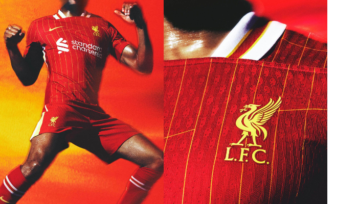 camisa titular do Liverpool 2024/25 Nike. A camisa é vermelha com listras amarelas verticais que formam a sigla "YNWA". A gola é branca com friso vermelho e bordas amarelas. As mangas são vermelhas com padrão listrado em amarelo e branco. Os punhos são vermelhos. No lado esquerdo do peito, o Liver Bird é amarelo. No lado direito do peito, o swoosh da Nike é amarelo. O patrocinador master é branco e está no centro da camisa.