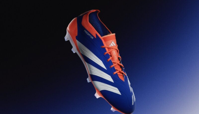 chuteira de campo adidas Predator 24 FG na cor azul, branco e laranja. O modelo possui cabedal sintético com a tecnologia HybridTouch 2.0, que proporciona amortecimento e conforto. As lâminas de borracha StrikeSkin estão posicionadas estrategicamente para melhorar o grip na bola. A placa de sola ControlFrame 2.0 é leve e otimiza a tração para movimentos rápidos e chutes precisos.