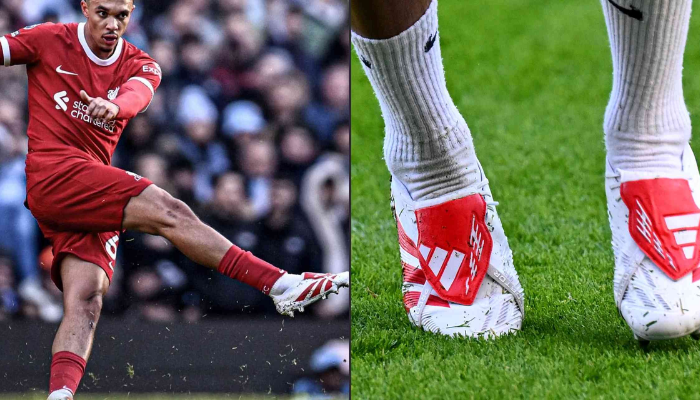 Chuteira Adidas Predator 24 Foldover Tongue FG ALEXANDER-ARNOLD em branco com detalhes em vermelho. A chuteira possui uma língua dobrável vermelha brilhante, três listras vermelhas nas laterais e o logotipo Adidas na parte superior do calcanhar. A sola da chuteira é preta com tachas brancas.