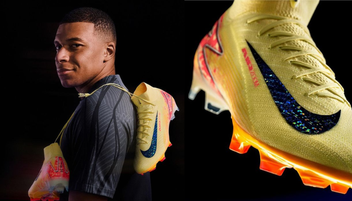 Chuteiras de futebol Nike Mercurial Superfly 10 Elite FG Mbappe em laranja com detalhes vermelhos. O design é inspirado em Kylian Mbappe e apresenta tecnologia avançada para velocidade e controle. O Nike Swoosh refletor e o logotipo 'KM' estão presentes.