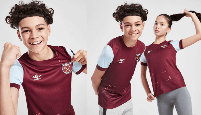 Conjunto Infantil West Ham 2023-2024: Camisa vinho e azul celeste com bolinhas de sabão, escudo do clube, logo Umbro, JD Sports e Betway. Ideal para jovens torcedores!