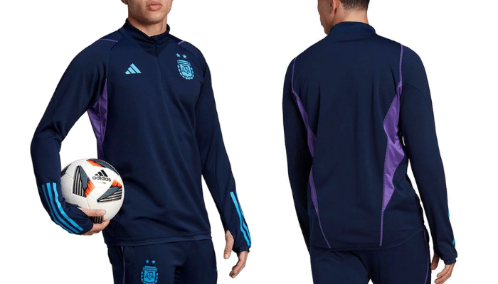 Jaqueta de Treino azul marinho com o escudo da AFA e o logo da Adidas em destaque. A jaqueta possui zíper frontal completo, gola alta e bolso lateral com zíper. Nas mangas, as listras da Adidas em branco completam o visual.