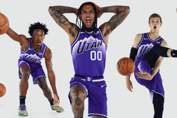 Regata City Edition Utah Jazz Nike 2023/24 em roxo e branco, inspirada no uniforme roxo da montanha de 1996-2002, com gradientes escalonados representando as majestosas cadeias montanhosas da Frente Wasatch.