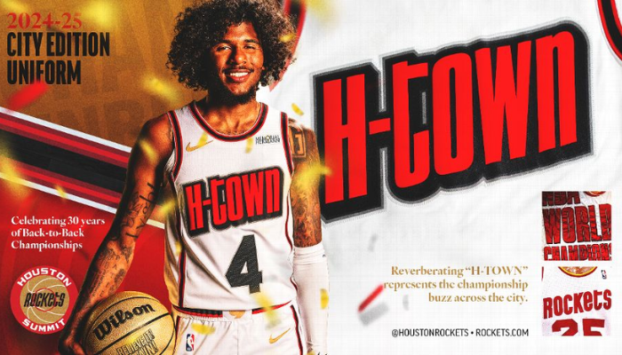 A camisa branca apresenta o logo "H-Town" em destaque, homenageando os títulos da NBA de 1994 e 1995. Detalhes nos shorts remetem à quadra The Summit e às bandeiras de campeonato. Na parte inferior, o slogan "ACREDITE! DE NOVO!"