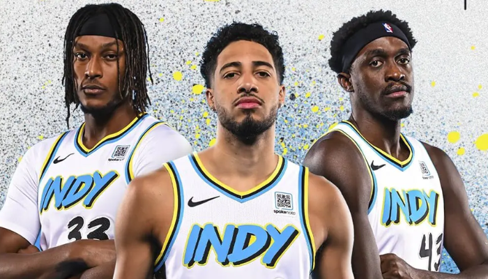 Regata City Edition 2024-25 do Indiana Pacers, com o logo "INDY" em destaque no peito, homenageando Indianápolis. Em branco, azul, amarelo e preto, reflete a identidade do time e a energia da torcida.