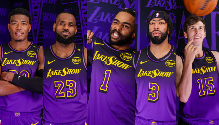 nova regata City Edition dos Los Angeles Lakers. A peça apresenta um design moderno com um gradiente de preto para roxo, que representa a evolução do time ao longo dos anos. O destaque fica por conta do icônico "Lake Show" estampado no peito, um símbolo da paixão e da tradição dos Lakers.