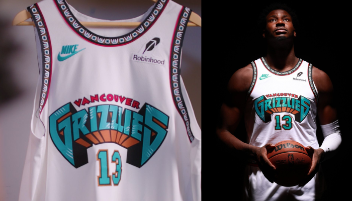 Regata do Memphis Grizzlies Classic Edition da Nike. A peça branca apresenta detalhes em verde e preto, com o logotipo gigante "Vancouver Grizzlies" na frente, homenageando a origem da franquia. 