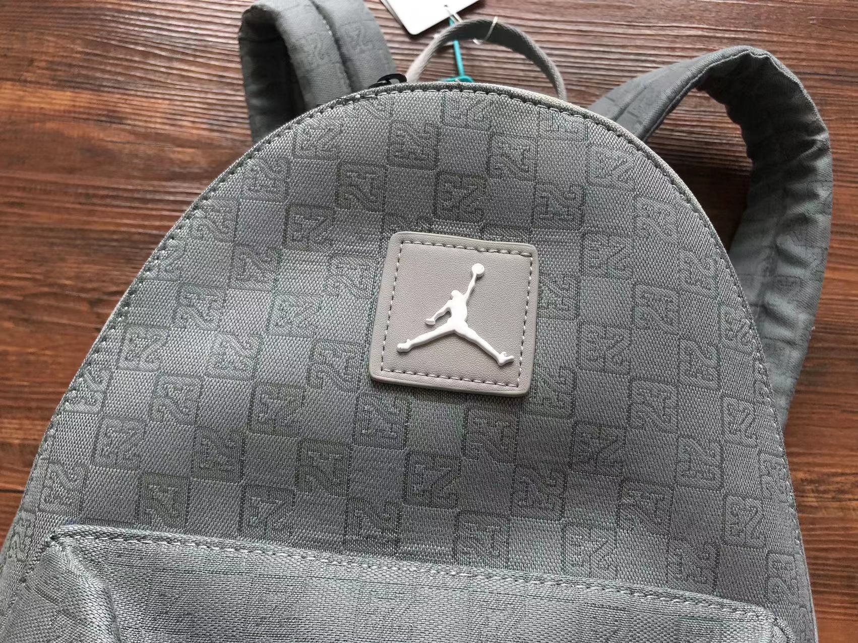 Discover the essence of style with the Jordan Monogram Backpack Bag