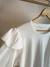 Remera con volados en internet