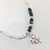 PULSERA REGULABLE CON CRISTALES, BOLITAS Y DIJE CENTRAL TREBOL - comprar online
