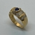 Anillo Love Realizado en Oro Amarillo 18klts y Circoña Engarzada a Mano, Zafiro central.