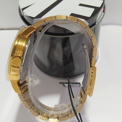 Relógio analógico masculino Xgames XMGS1011 P2KX Dourado e preto na internet