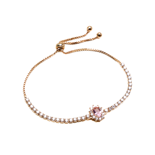 Pulseira linda regulável com zirconias brancas cravejadas e cristal rosa folheada a ouro 18k.