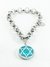 Pulsera rolo con dije estrella de david con piedra celeste acero