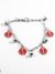 Pulsera con dijes vaquita de san antonio con esmalte rojo acero