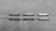 chapita con logo - Medida 25 x 4 mm ( Art 3854 ) x 1000 unidades - SISTEMA LASER