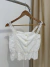 Musculosa multimarca tejida botones T.S